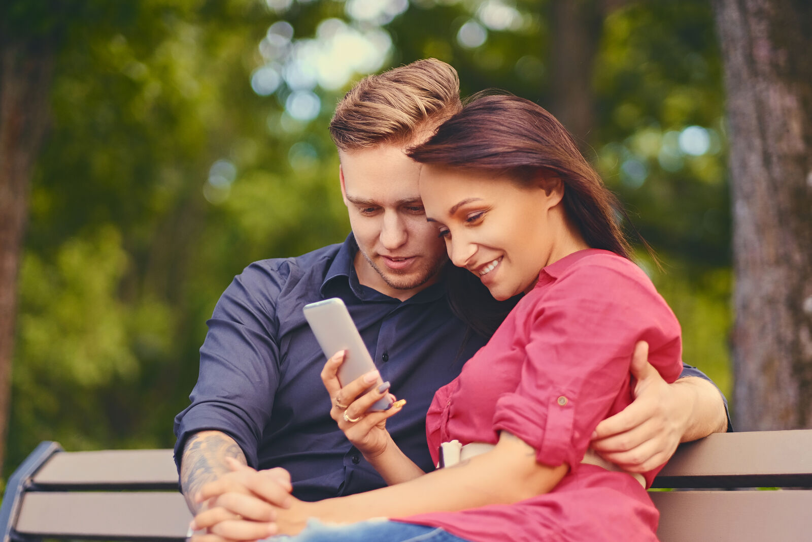 Diverse couple from different cultural backgrounds holding hands together, representing multicultural dating